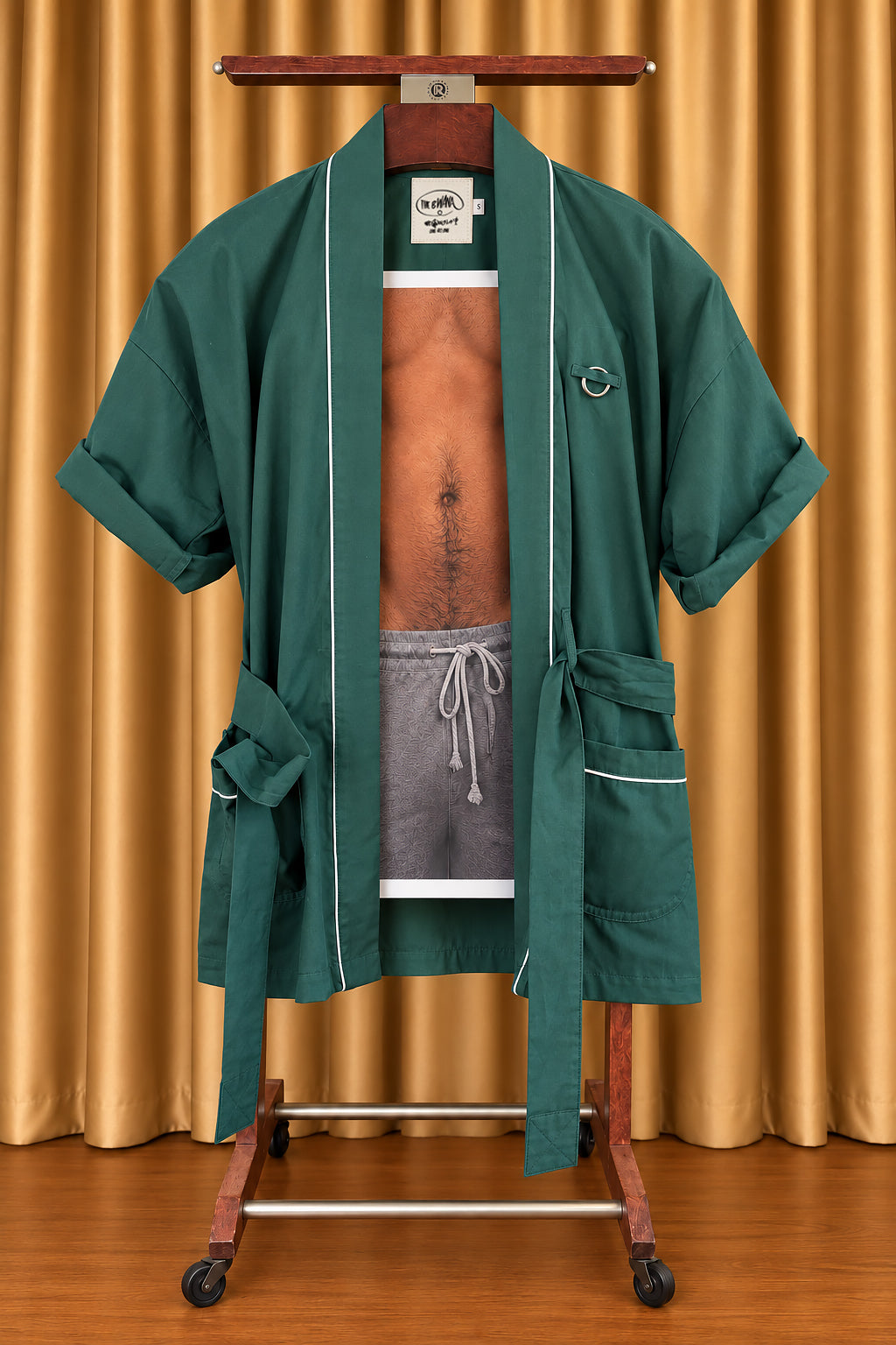 DEEP GREEN Bwana, belt open, on a wooden valet stand