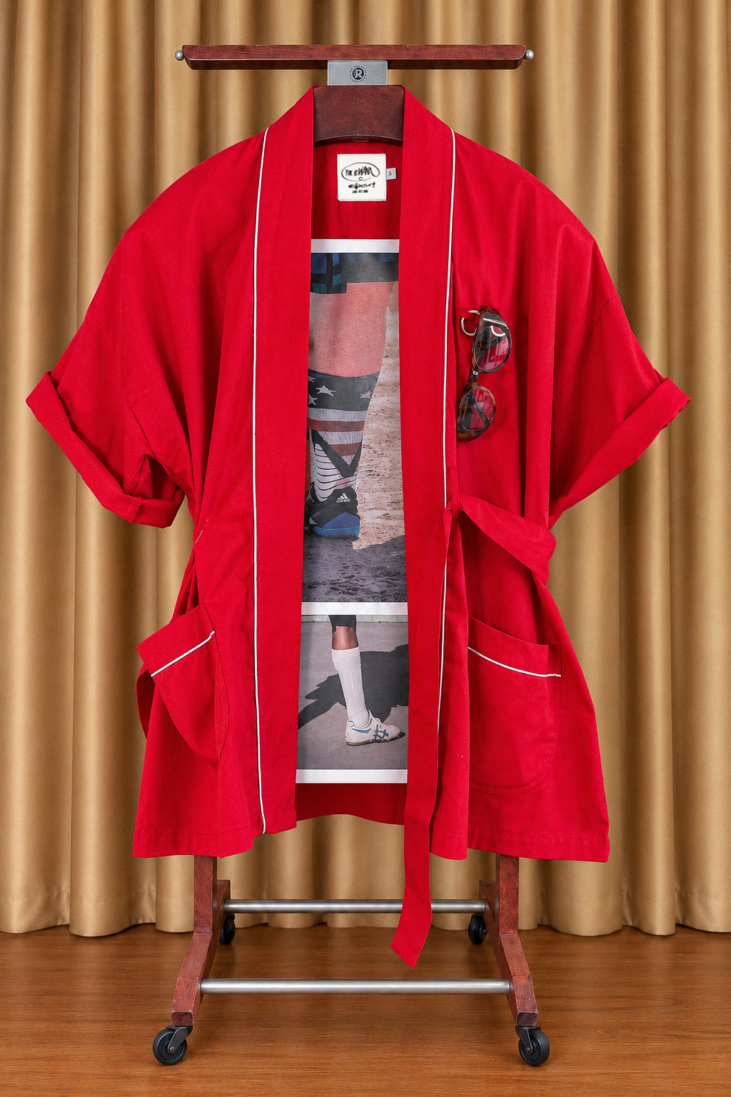 RED Bwana, belt open, on a wooden valet stand